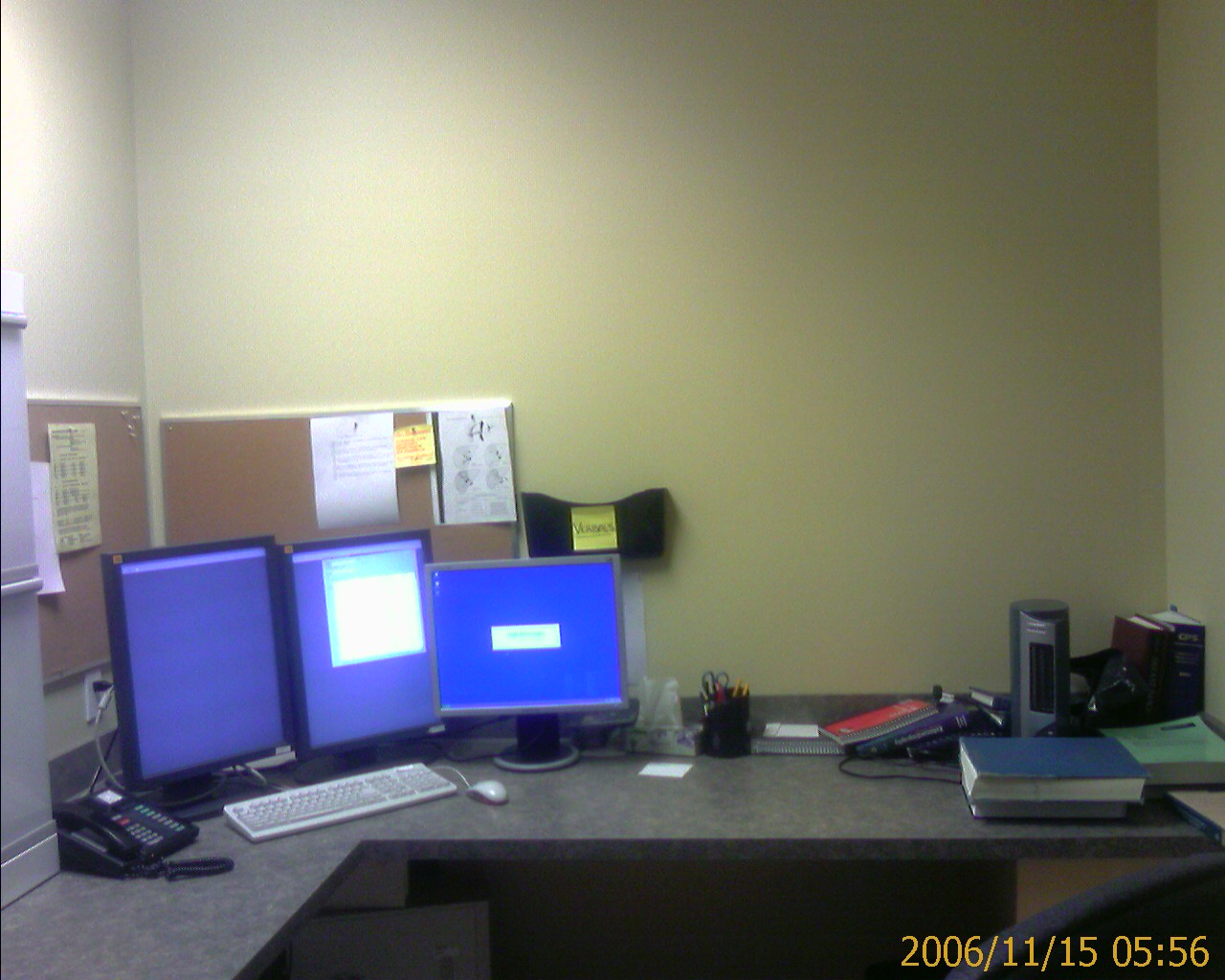 the two desktop computers are sitting on the desk