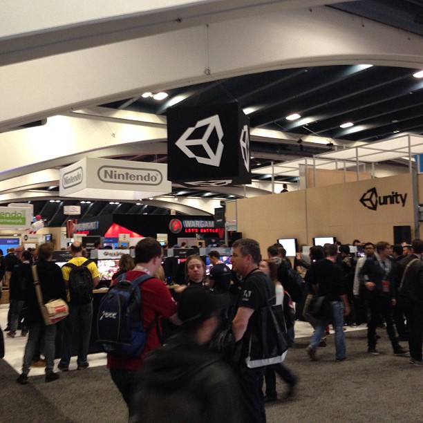 the crowd is all standing in line at the convention