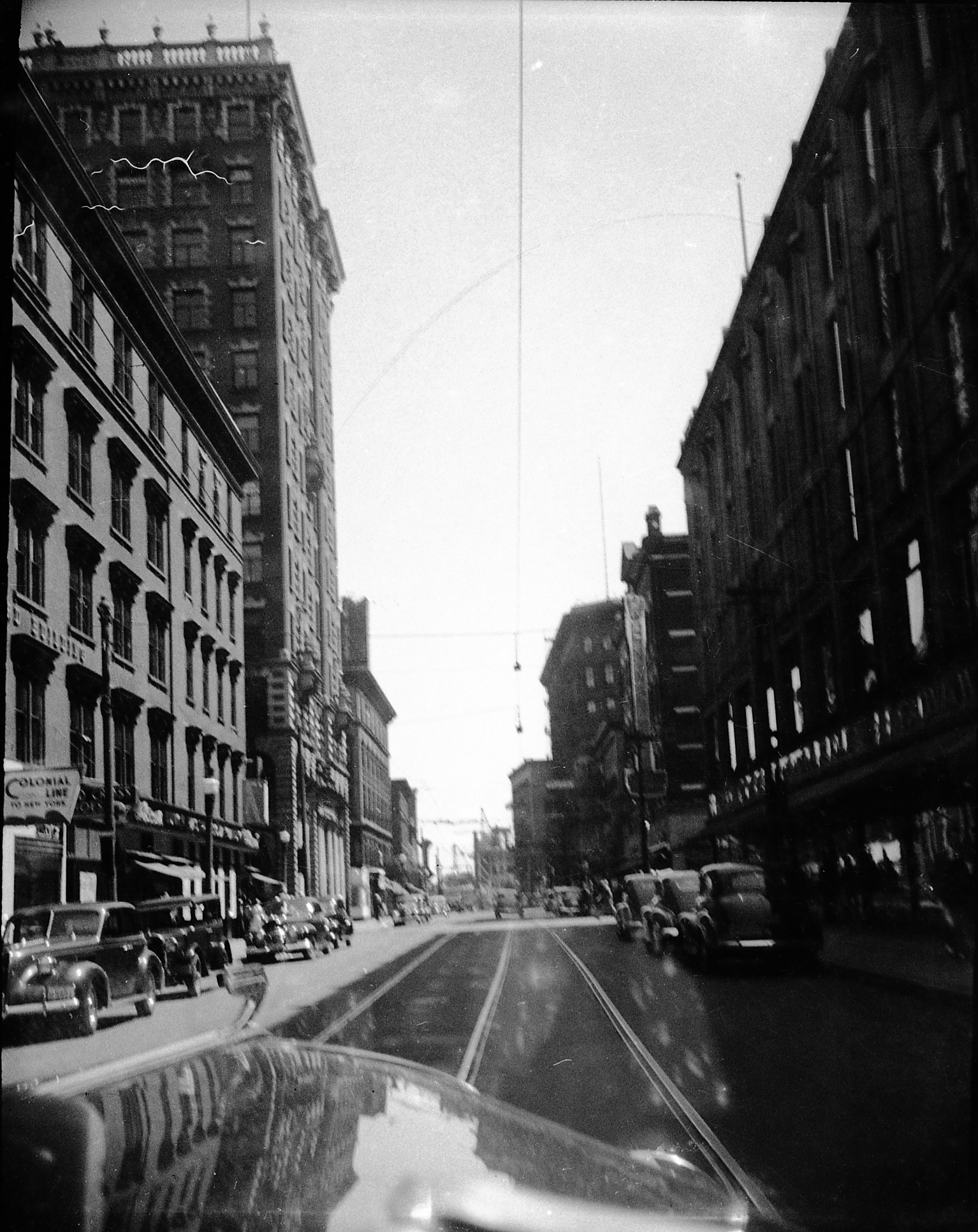 an old black and white po of a view of an urban street