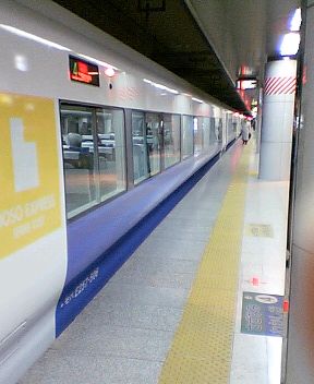 a train that is next to a platform at the station