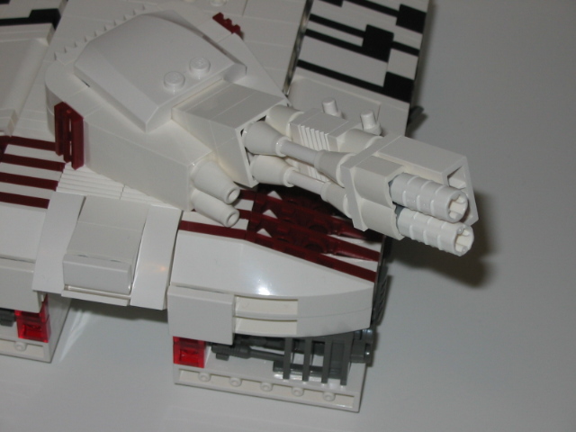 white robot type with red details and two guns on it