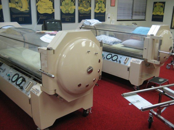 some kind of big roll up machine with bed behind it