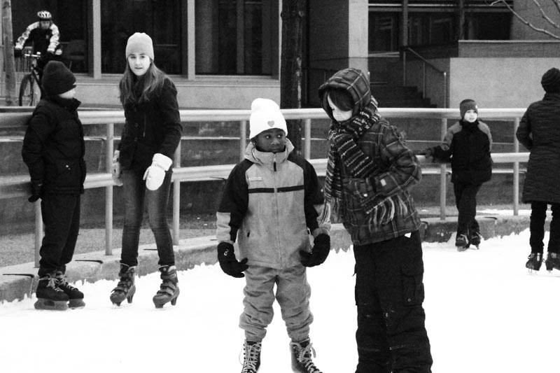 a group of children playing in the snow