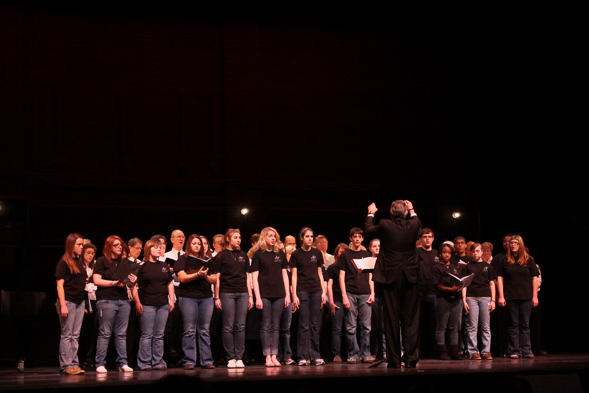 a group of people standing next to each other on a stage