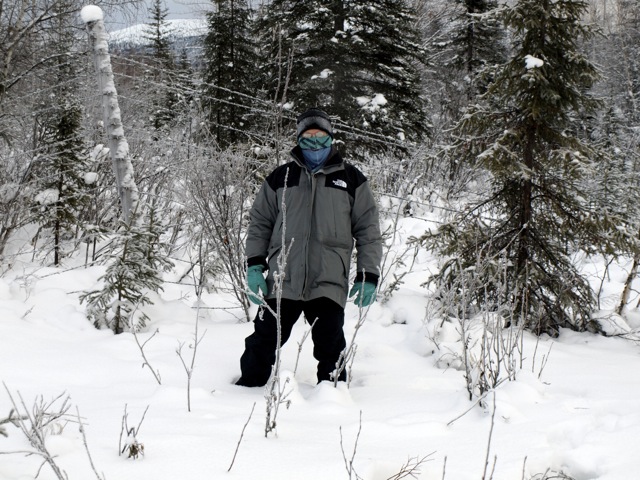 a person standing in the snow in their ski equipment