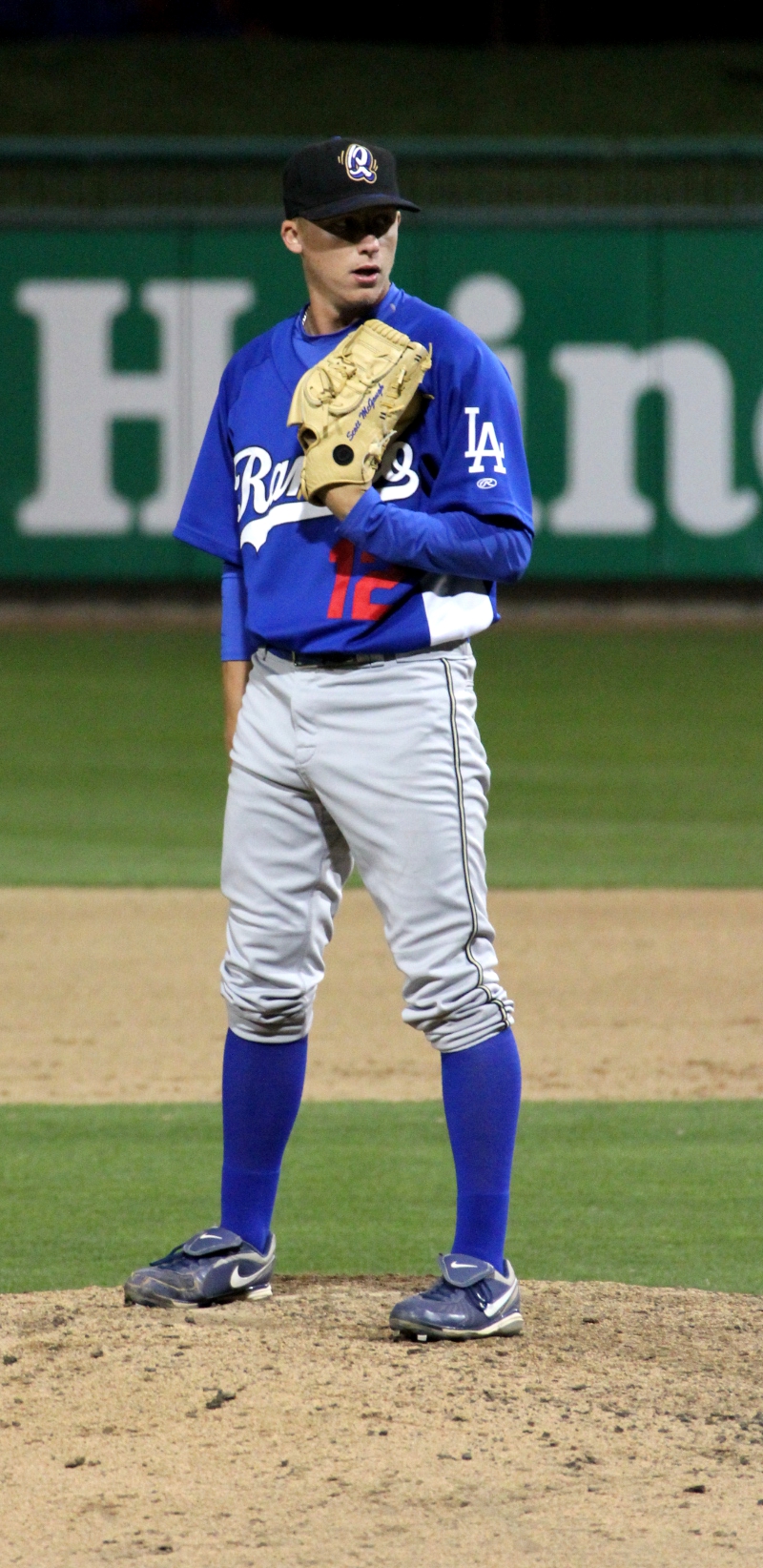 a baseball player standing on the pitchers mound