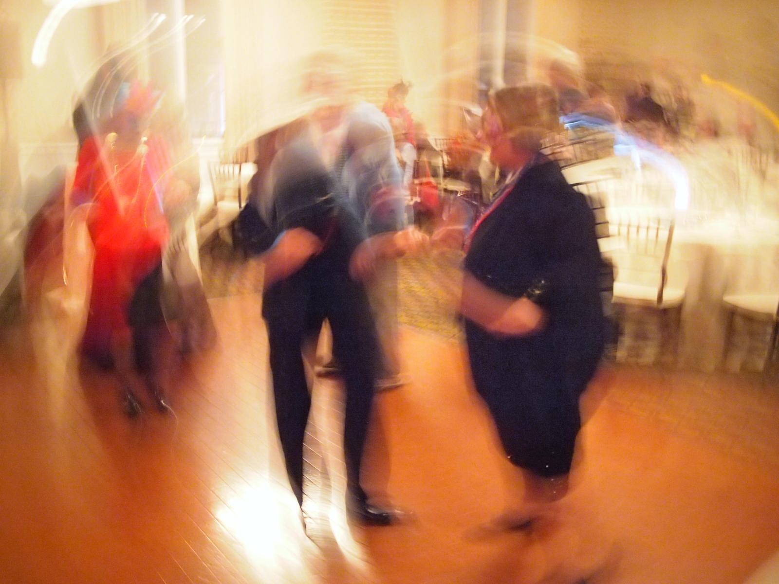 blurry image of people dancing in the lobby