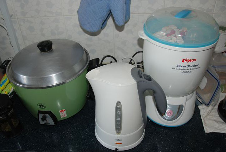 kitchen appliances are lined up on the counter