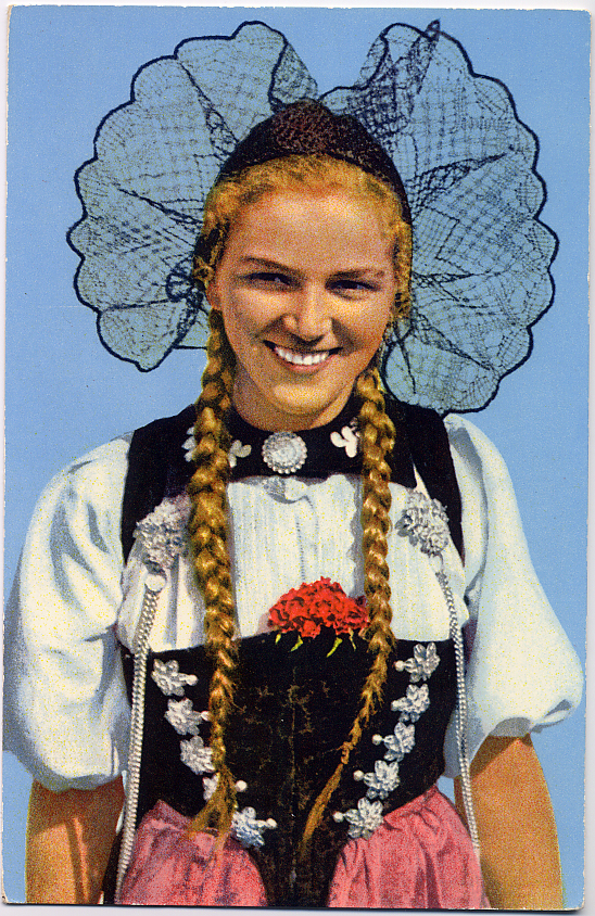 a woman with ids smiling in her country attire