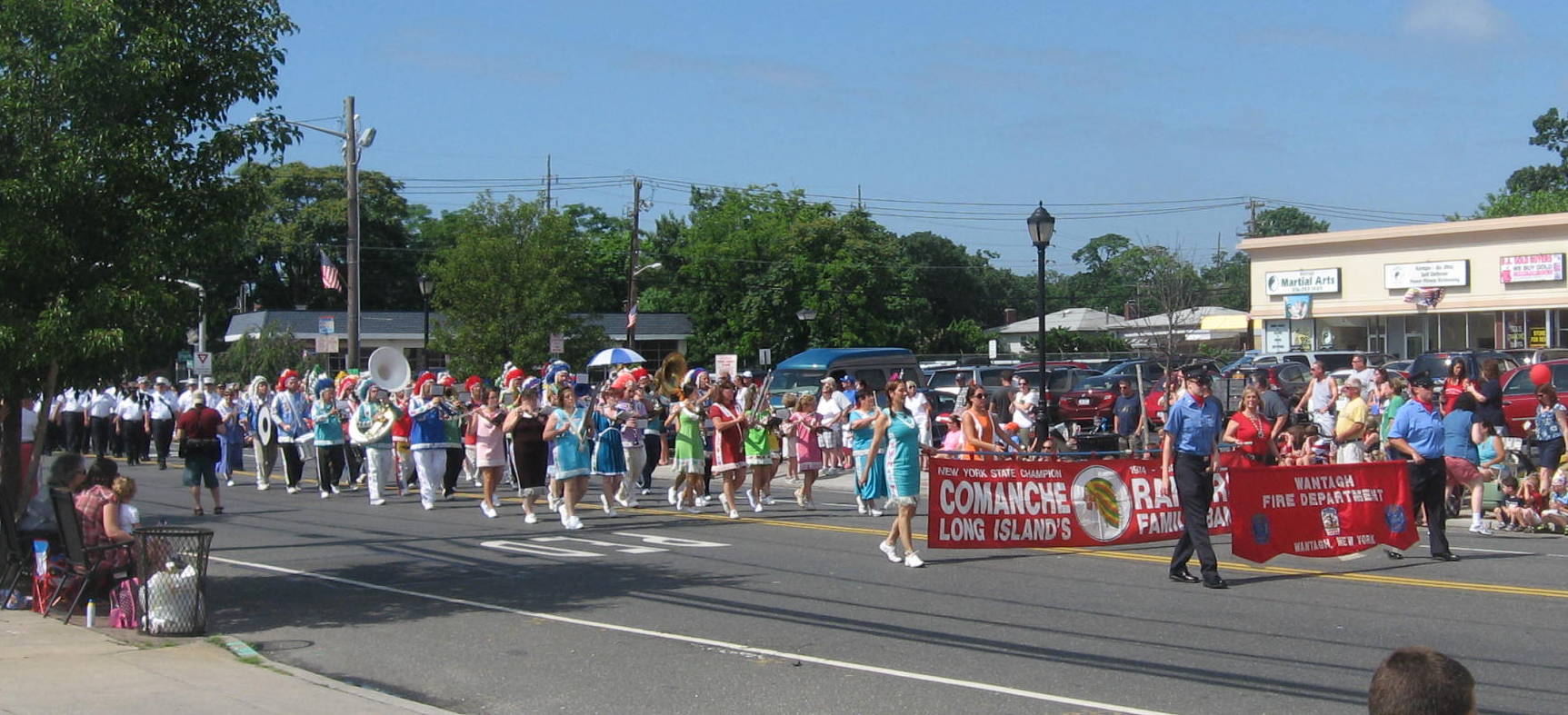 a parade in the street with people on a float