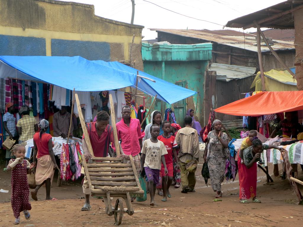 several women and children walking around a busy area