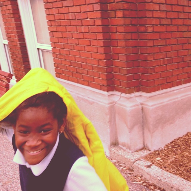 a child in a banana costume is smiling