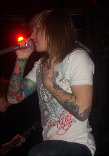 a man holding a microphone up to his mouth