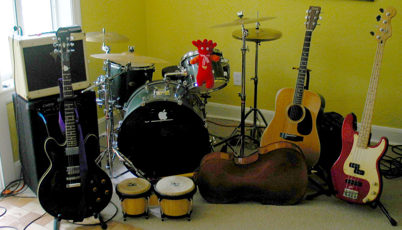 many guitars, drums and some electronic equipment