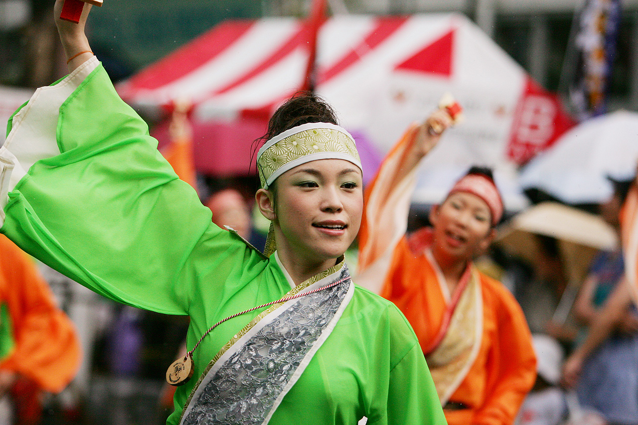 a person dressed in a costume waving a flag