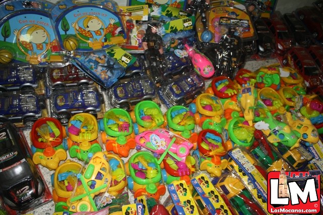 a table with a variety of toys and electronics