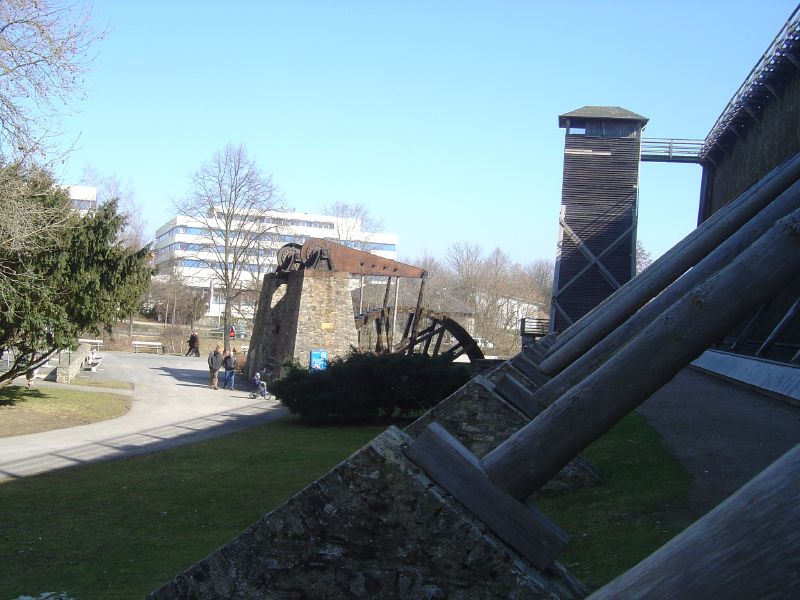 a view of a park, trees, and large structures