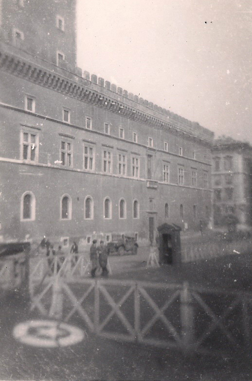 a black and white po of people standing in front of a building