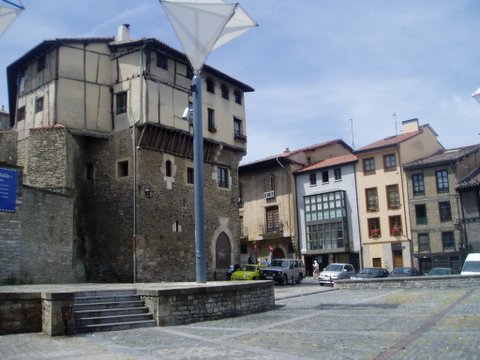 several buildings with buildings in the back ground