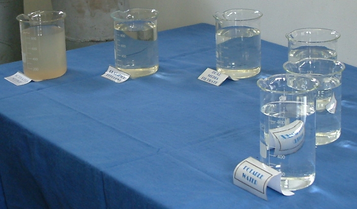 a number of glasses on a blue table