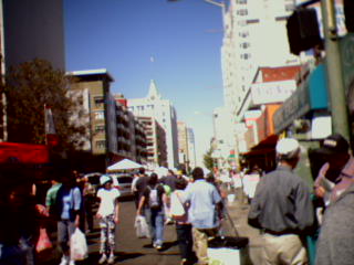 many people walking on the street in an urban area