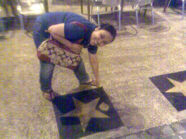 the woman is placing stars on the floor