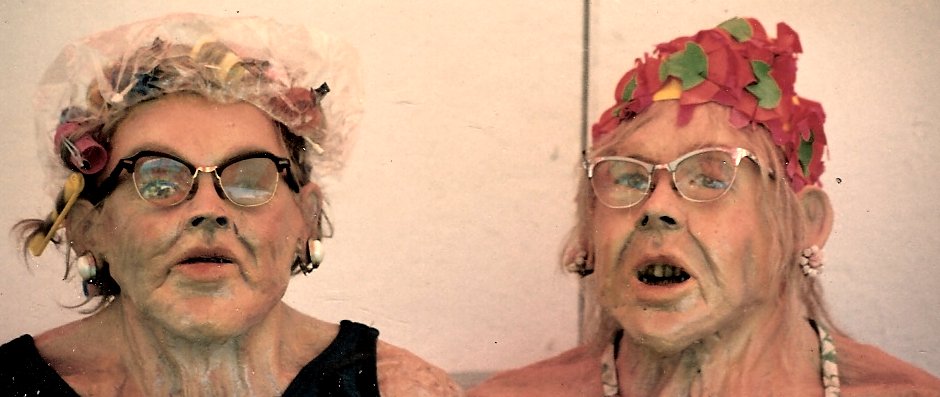 an elderly couple in glasses making funny faces