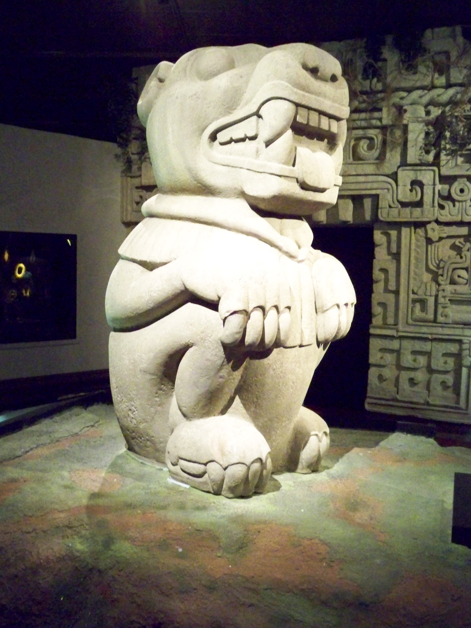 there is a large stone sculpture on display in the room