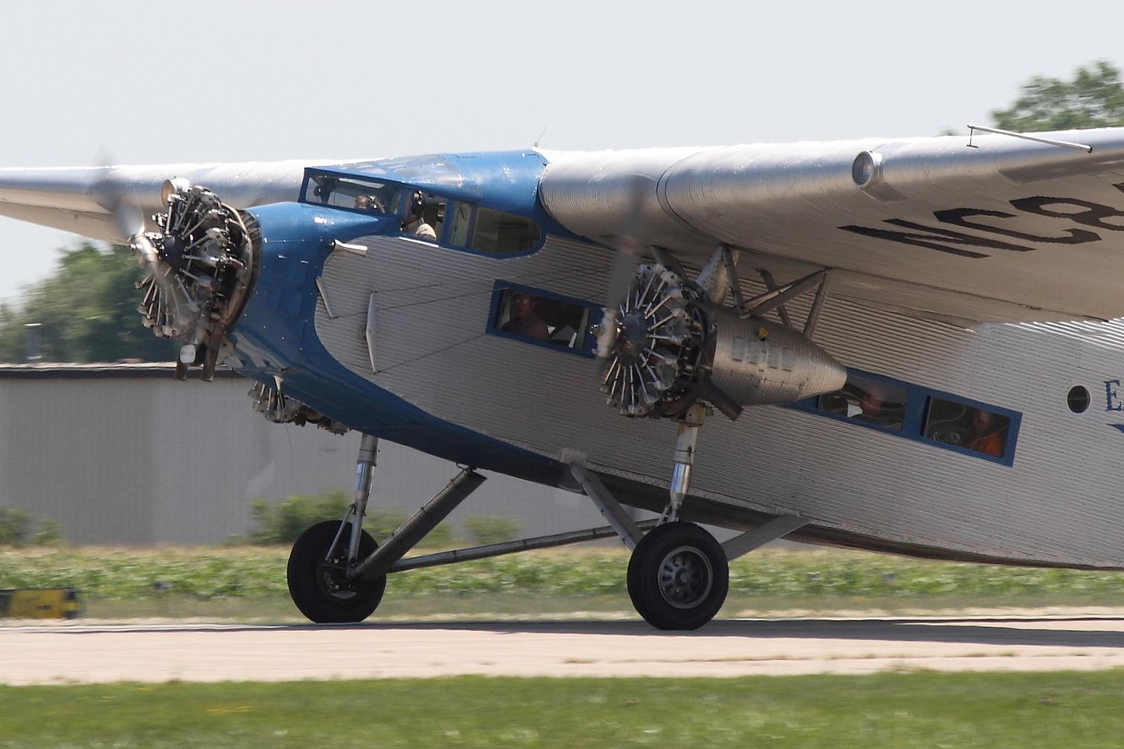 a small airplane with the cockpit open on a runway