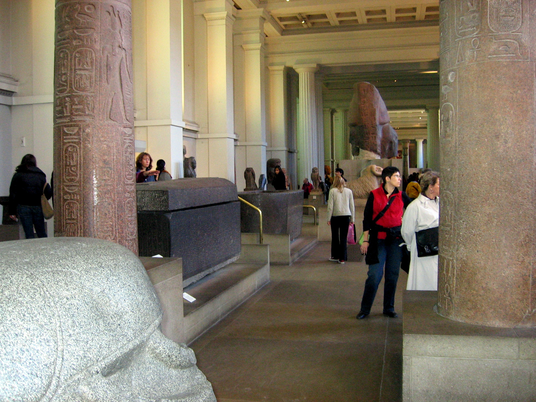 a group of people walking in a hallway