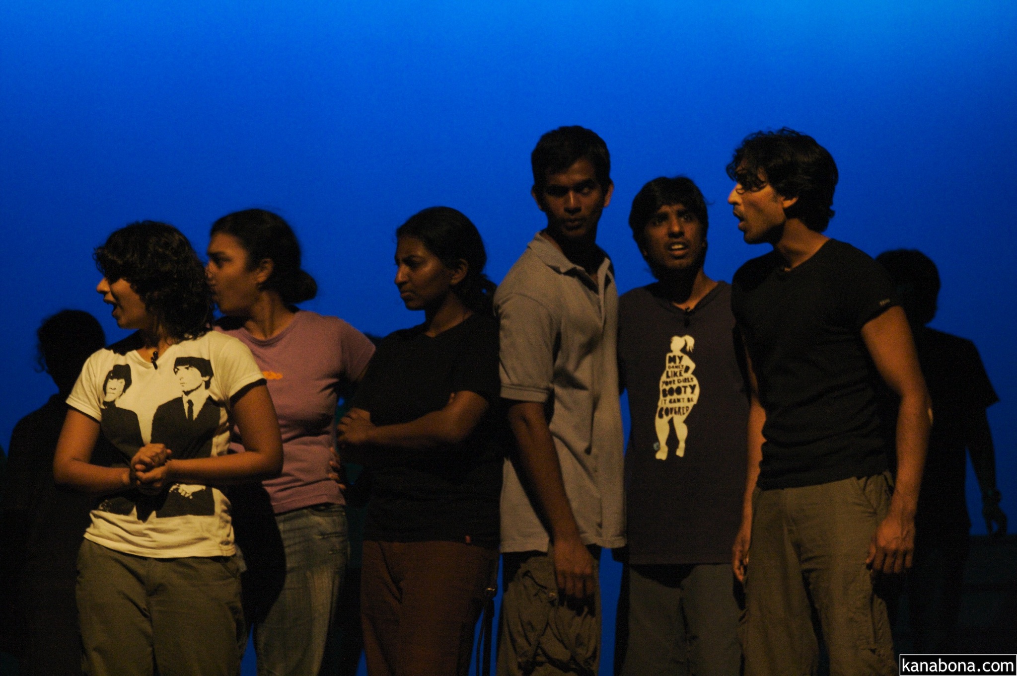 a group of young people standing next to each other