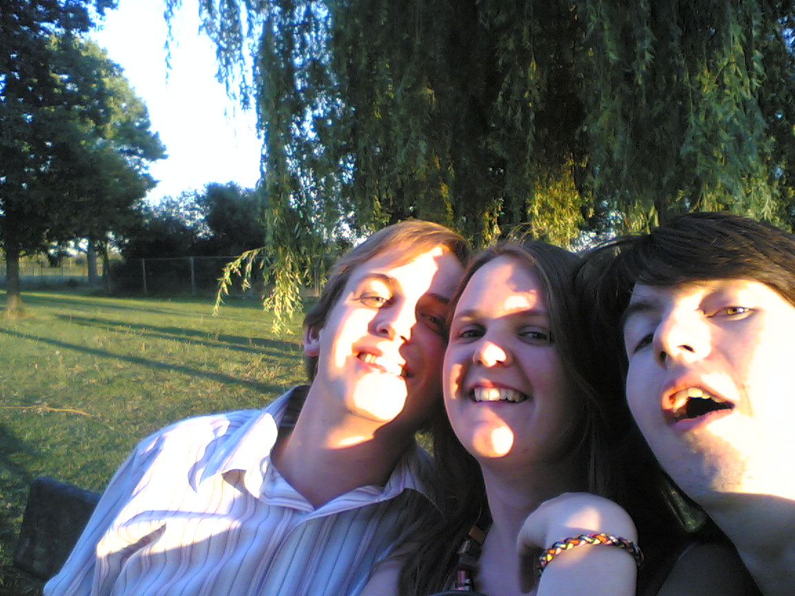 four friends are enjoying an afternoon in the park