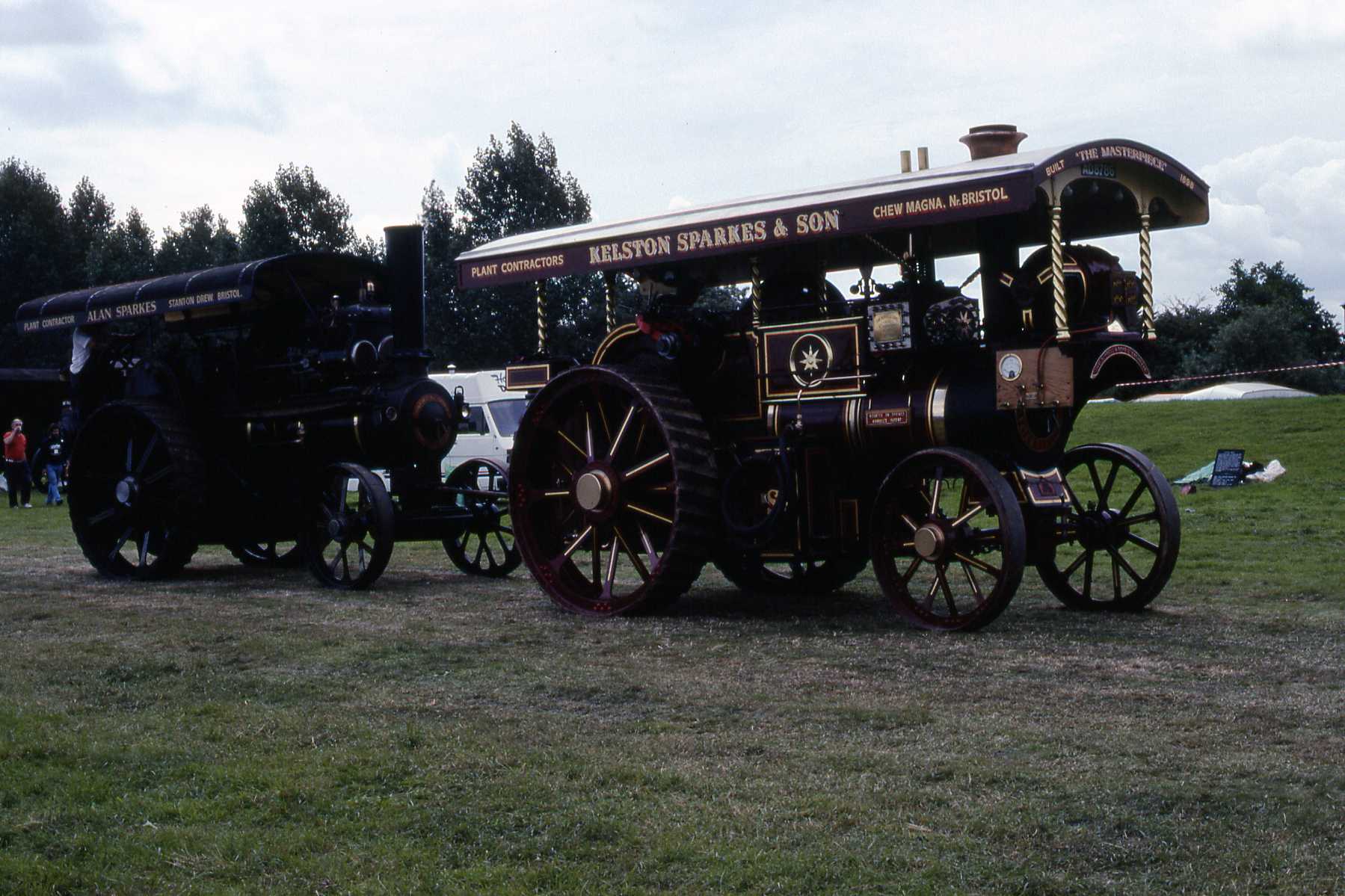 old steam engine and cab for event in grassy area