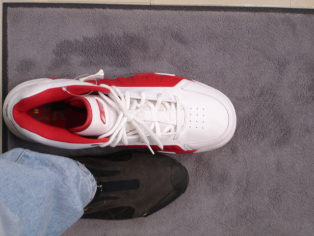 the sneakers on the man are red and white