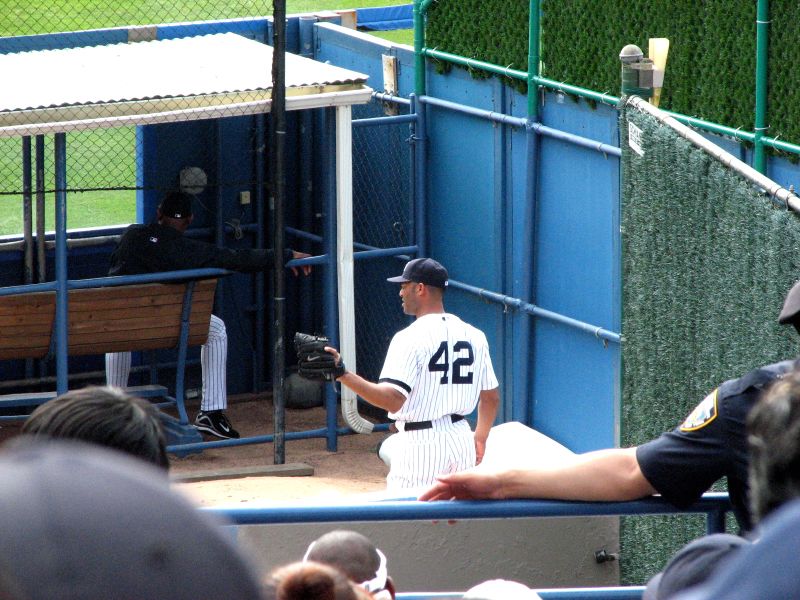 a baseball player standing at the end of the box