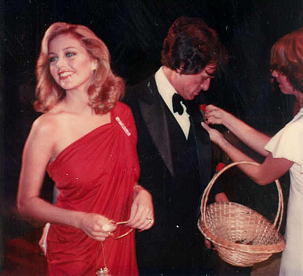 a woman in a red gown at an event