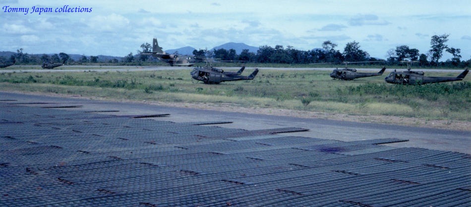 several abandoned war planes are parked by the side of the road