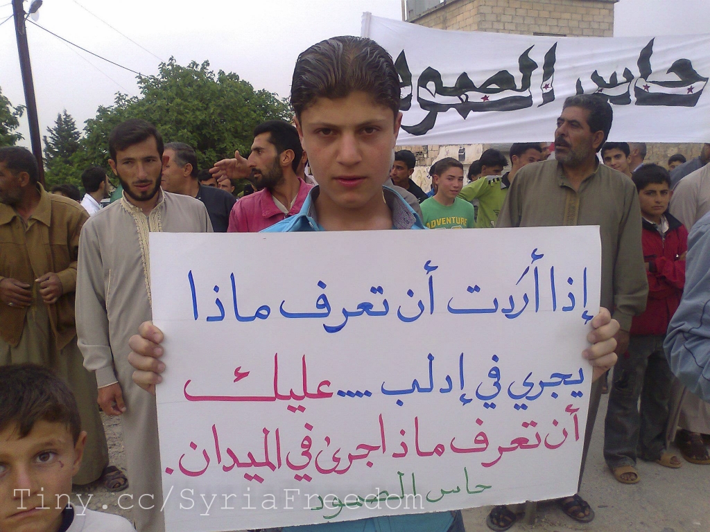 a protester holds up a sign during a demonstration