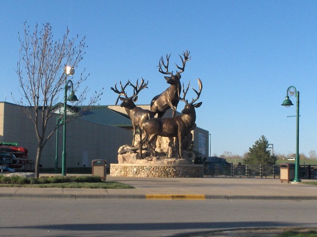 there is a statue that has some very large animals on it