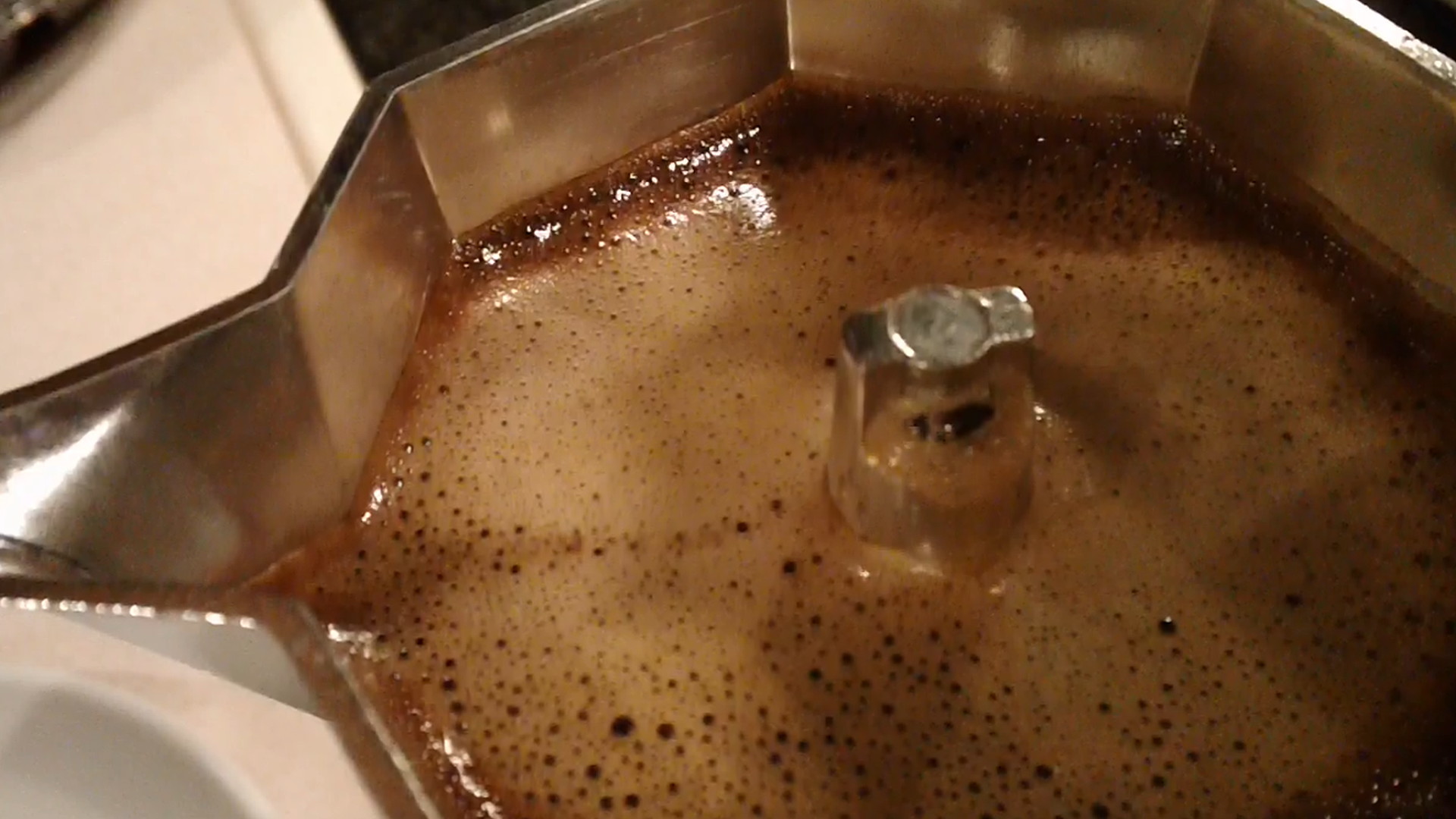 a sink filled with brown liquid on top of a counter