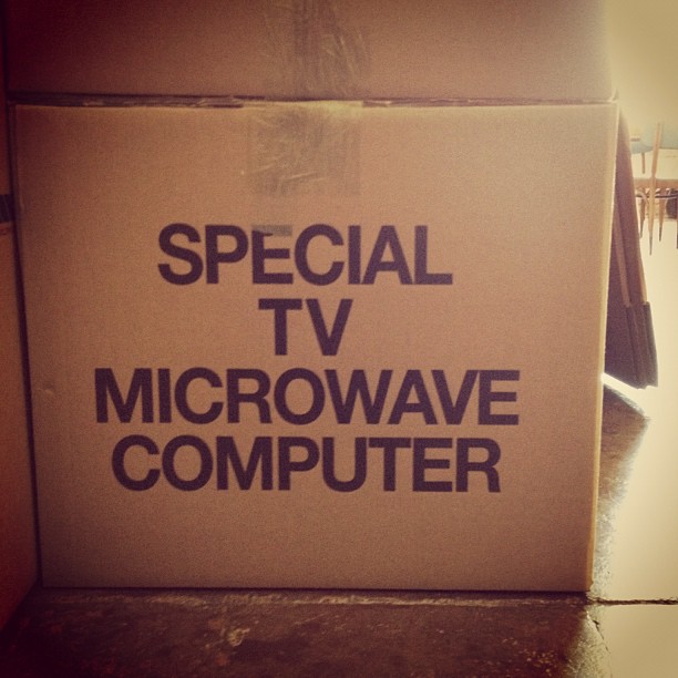 a tv in a box that says special tv microwave computer