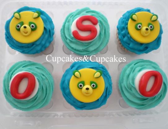the cupcakes have colorful frosting and characters on them