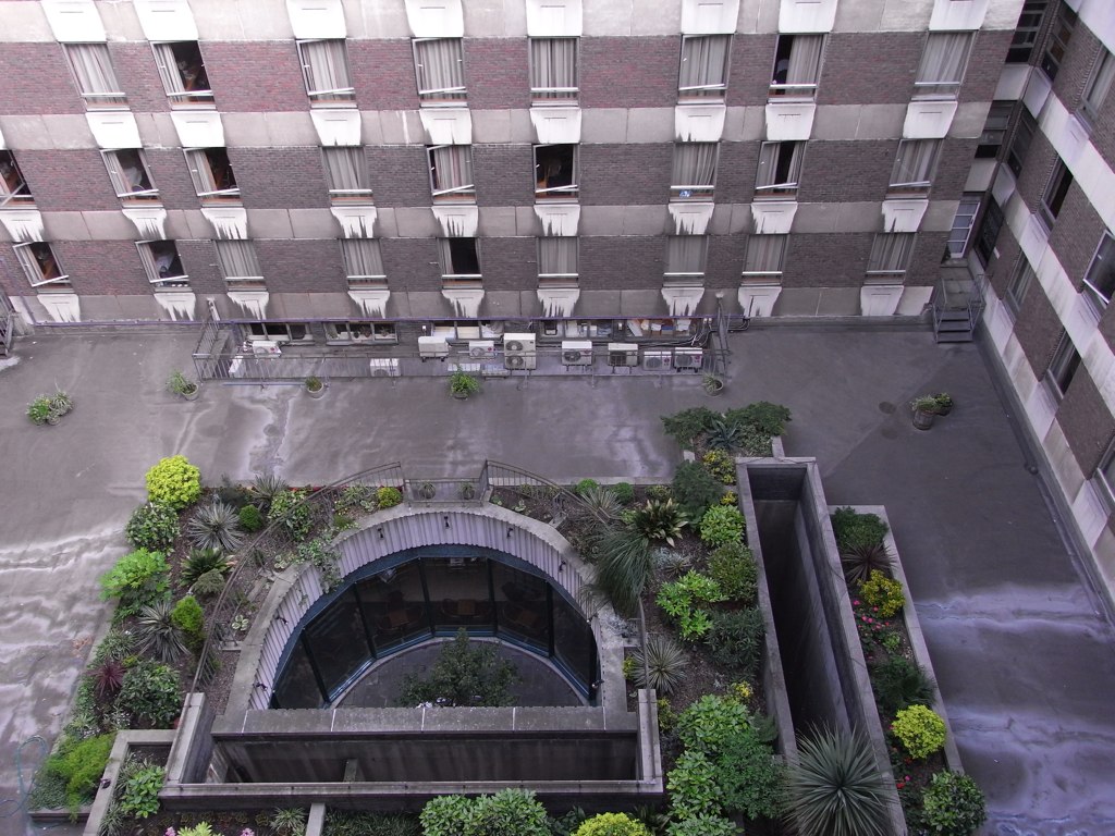 view of a courtyard of an apartment building, from above