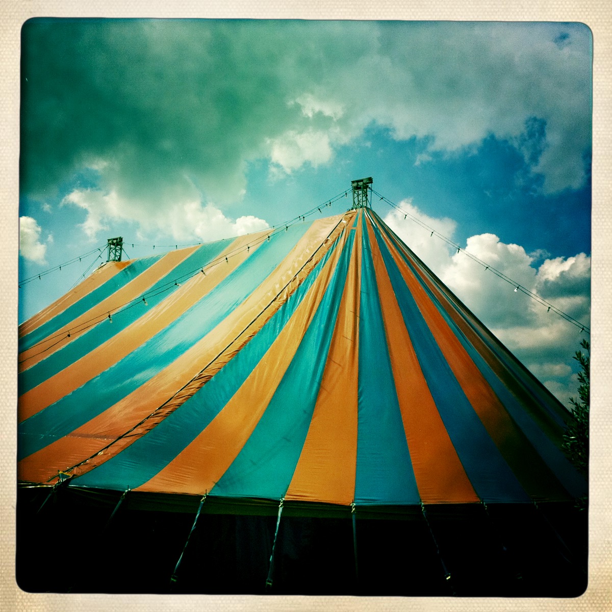 the big top circus tent is blue and yellow