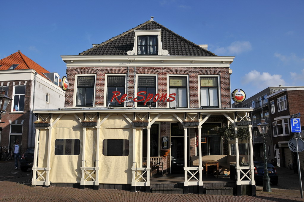 a building with people sitting at it's front