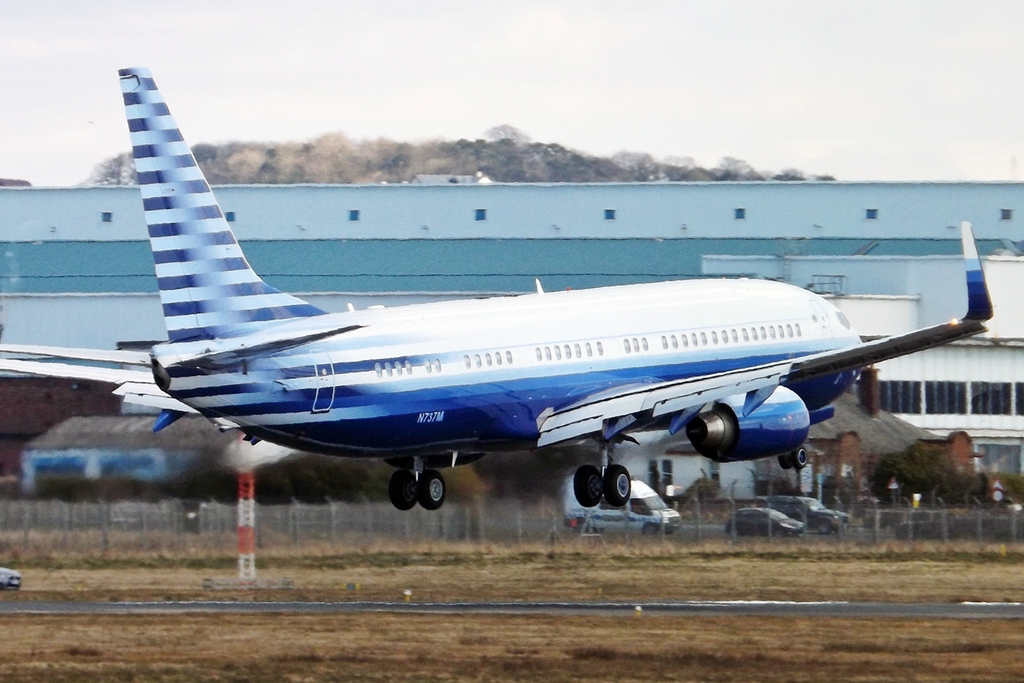 an airplane with blue and white striped tails
