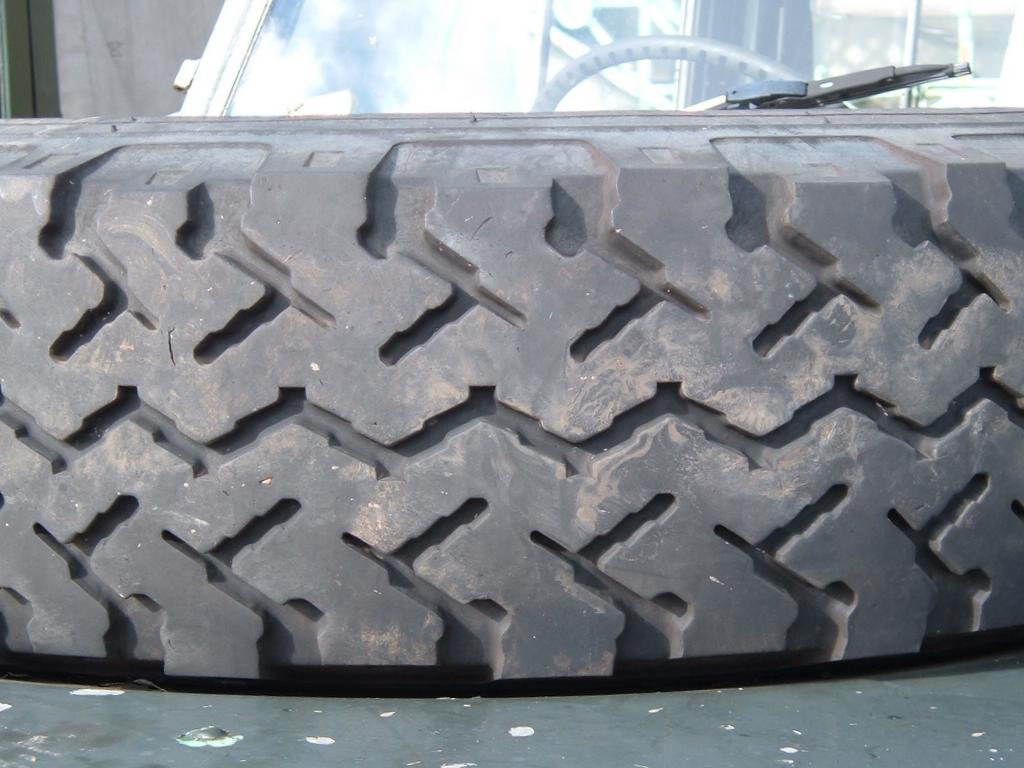 close up s of tread on tires of an automobile
