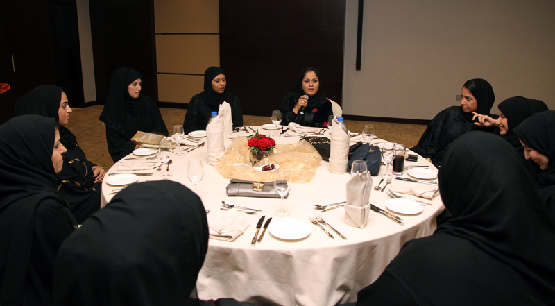 group of muslim women sitting at table together