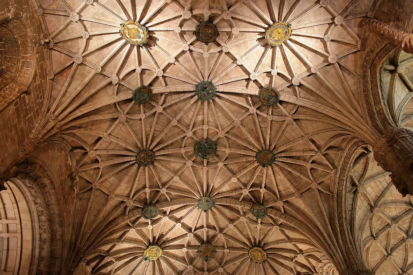 the dome ceiling of a large building with a clock above