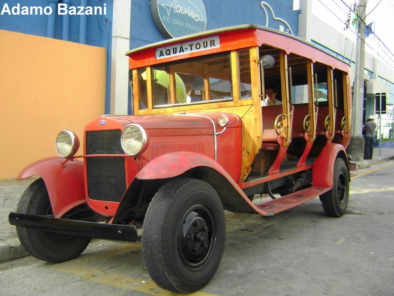 an old red bus with an open front door